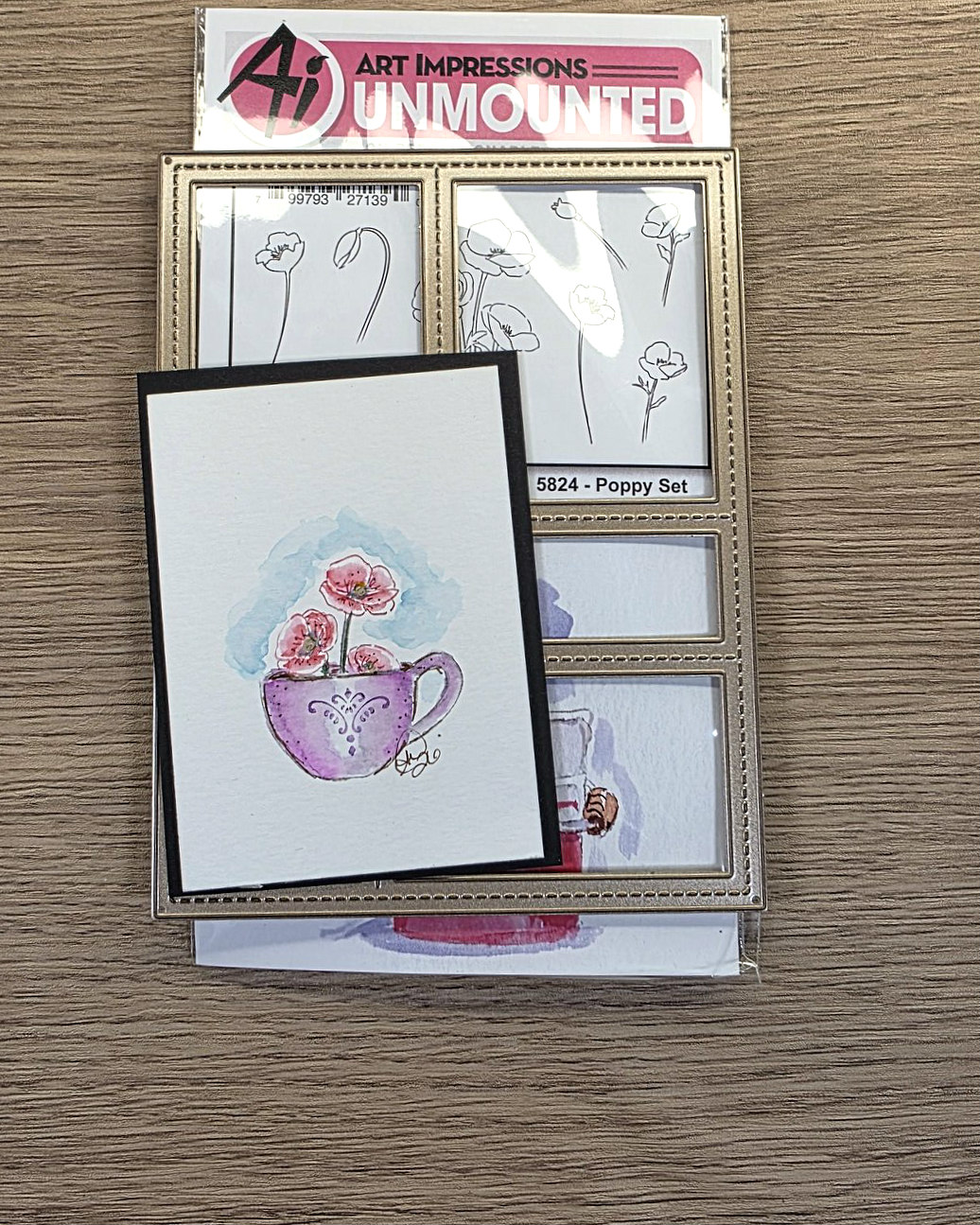 watercolor ATC card Poppy flowers red in a lavender cup showing a postage stamp die and the Poppy Watercolor stamp packaging from Art Impressions